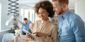 MIS Active Management Systems Man and Woman using tablet device